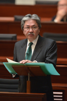 The Financial Secretary, Mr John C Tsang, presents the 2014-15 Budget in the Legislative Council on 26 February