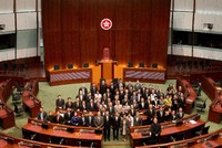 Members of the Fifth LegCo take a group photo after their first meeting on Oct 10.